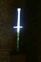 Inside the gatehouse, the narrow slits would have been used by archers. Photograph © P Fiennes Inside the gatehouse, the narrow slits would have been used by archers. Photograph © P Fiennes