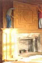 Workmen refashion the Oak Room's fireplace.